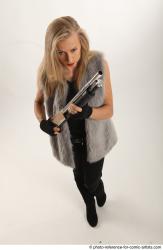 NIKOL STANDING POSE WITH SHOTGUN